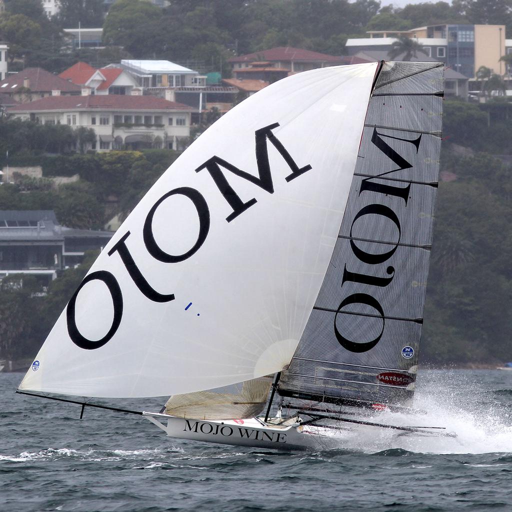 Mojo Wine powers down the spinnaker run © Frank Quealey